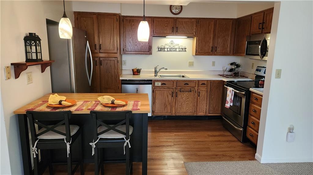 830 South Main Street, Unit 211 Washington, PA 15301 - Photo 3 of 17 a kitchen with granite countertop a sink appliances and cabinets