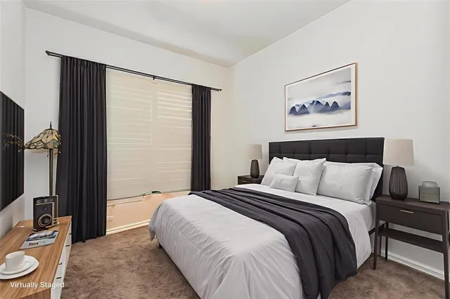 a bedroom with a bed and a bathroom