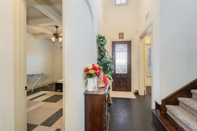 a view of entryway and wooden floor