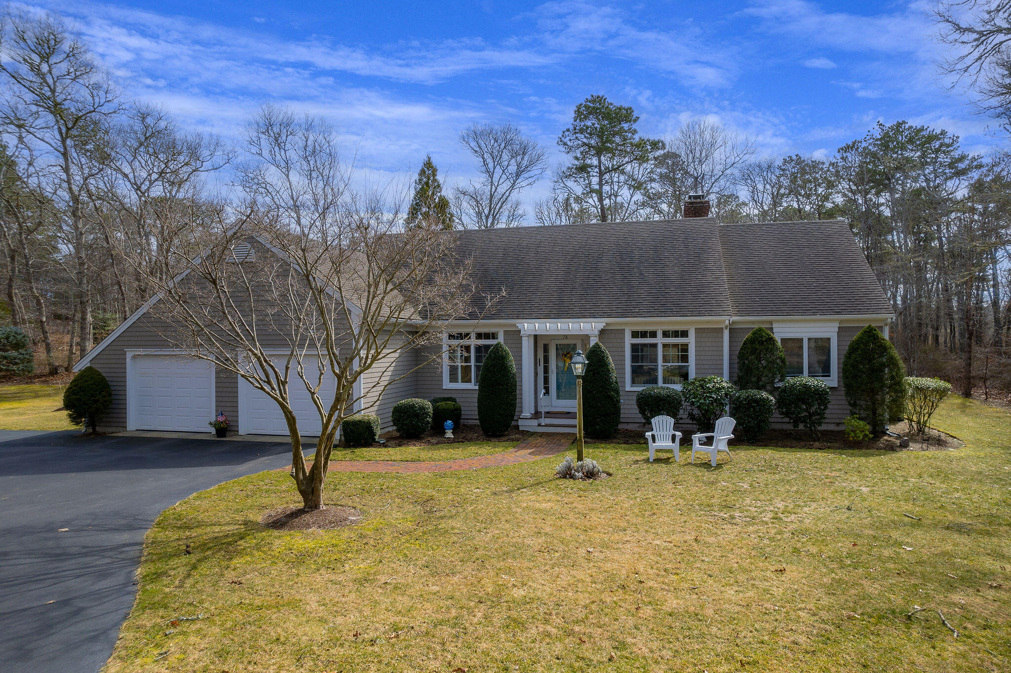a view of house with outdoor space and sitting area