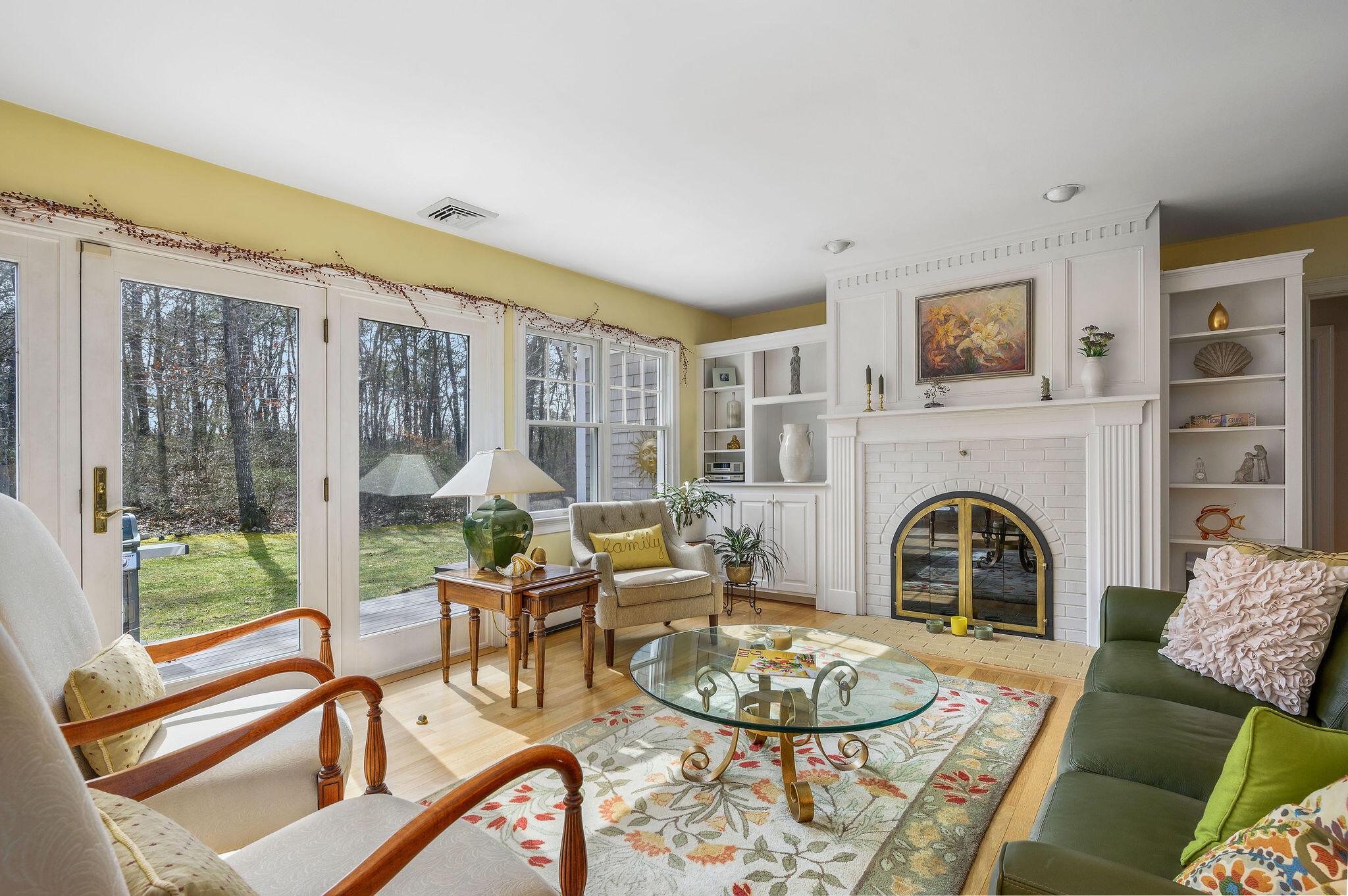78 Red Maple Road Brewster, MA 02631 - Photo 11 of 39 a living room with fireplace furniture and a floor to ceiling window