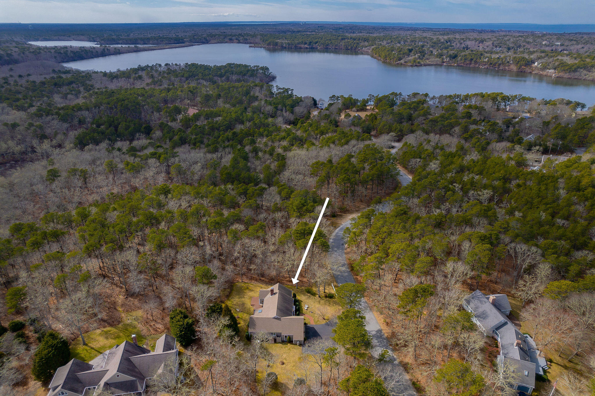78 Red Maple Road Brewster, MA 02631 - Photo 2 of 39 a view of a houses with a forest