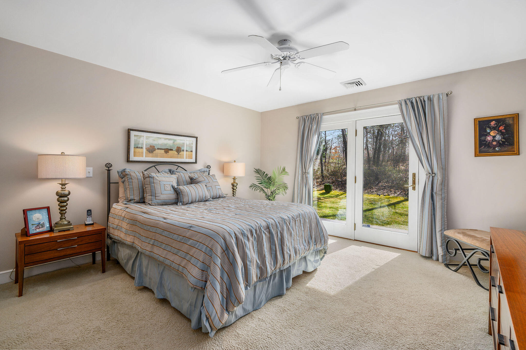 78 Red Maple Road Brewster, MA 02631 - Photo 21 of 39 a spacious bedroom with a bed and a chandelier