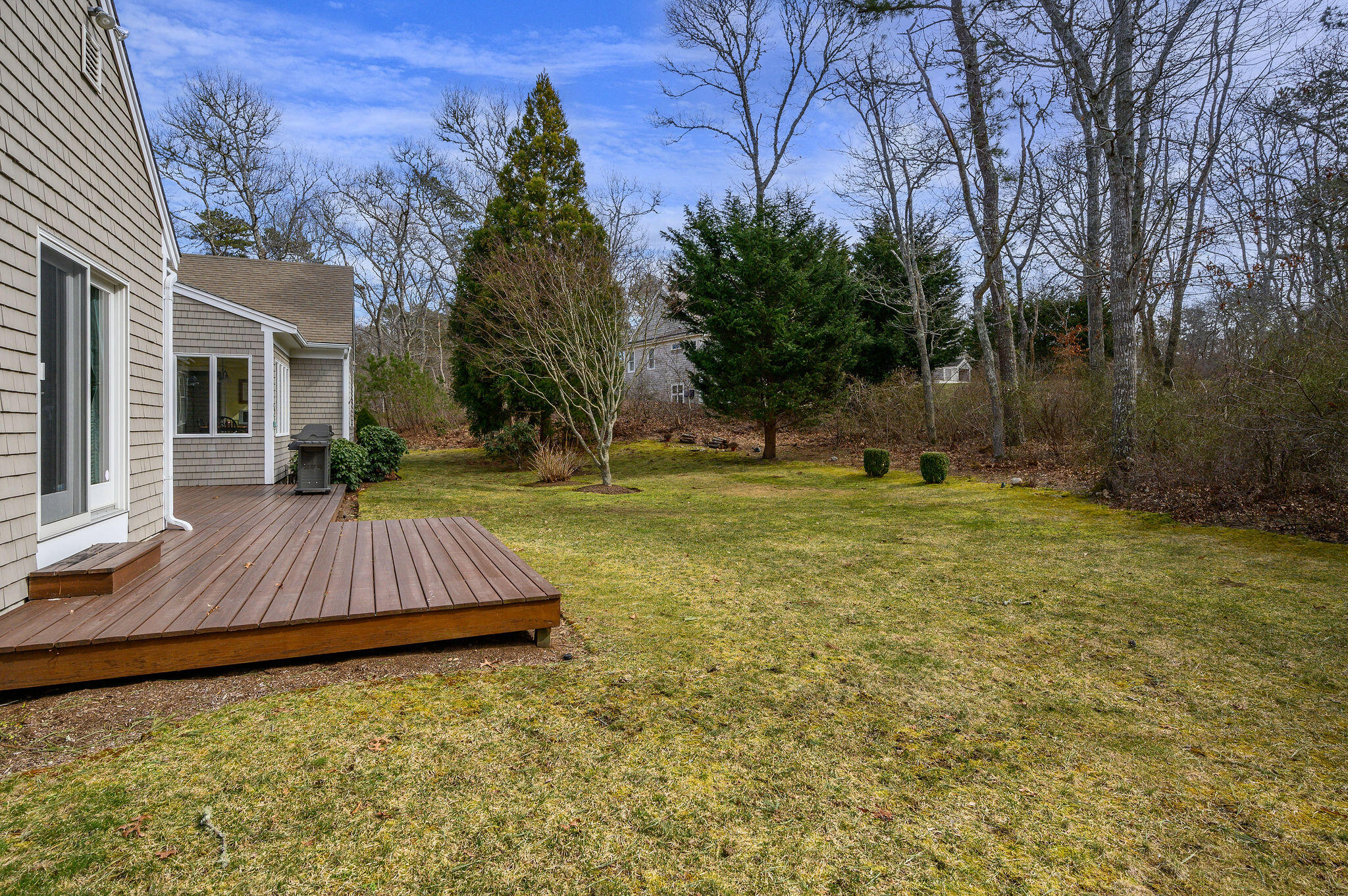 78 Red Maple Road Brewster, MA 02631 - Photo 34 of 39 a view of a house with backyard and trees