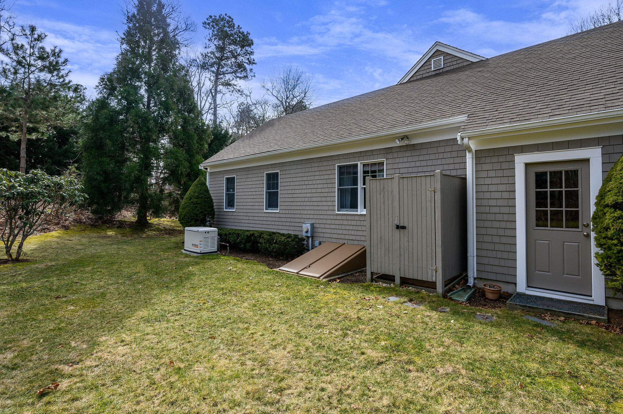 78 Red Maple Road Brewster, MA 02631 - Photo 36 of 39 a view of a house with backyard and trees