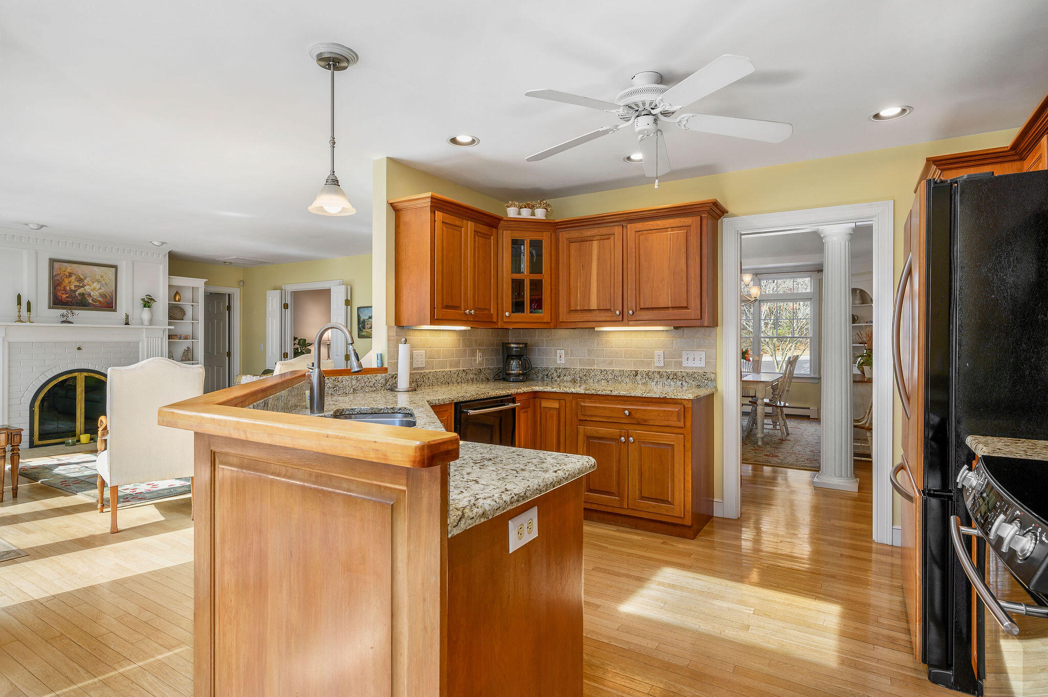 78 Red Maple Road Brewster, MA 02631 - Photo 7 of 39 a kitchen with stainless steel appliances granite countertop a sink stove and refrigerator