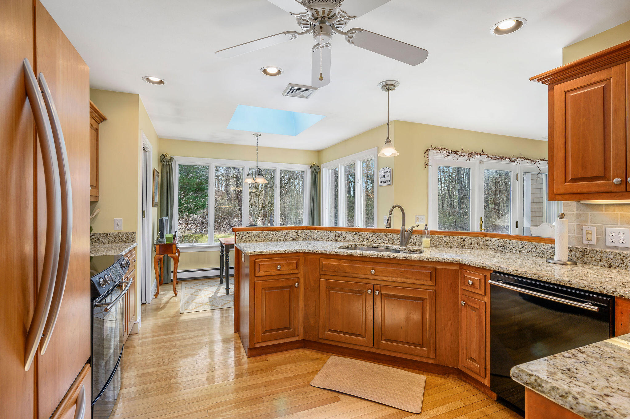 78 Red Maple Road Brewster, MA 02631 - Photo 8 of 39 a open kitchen with stainless steel appliances granite countertop a sink stove and refrigerator