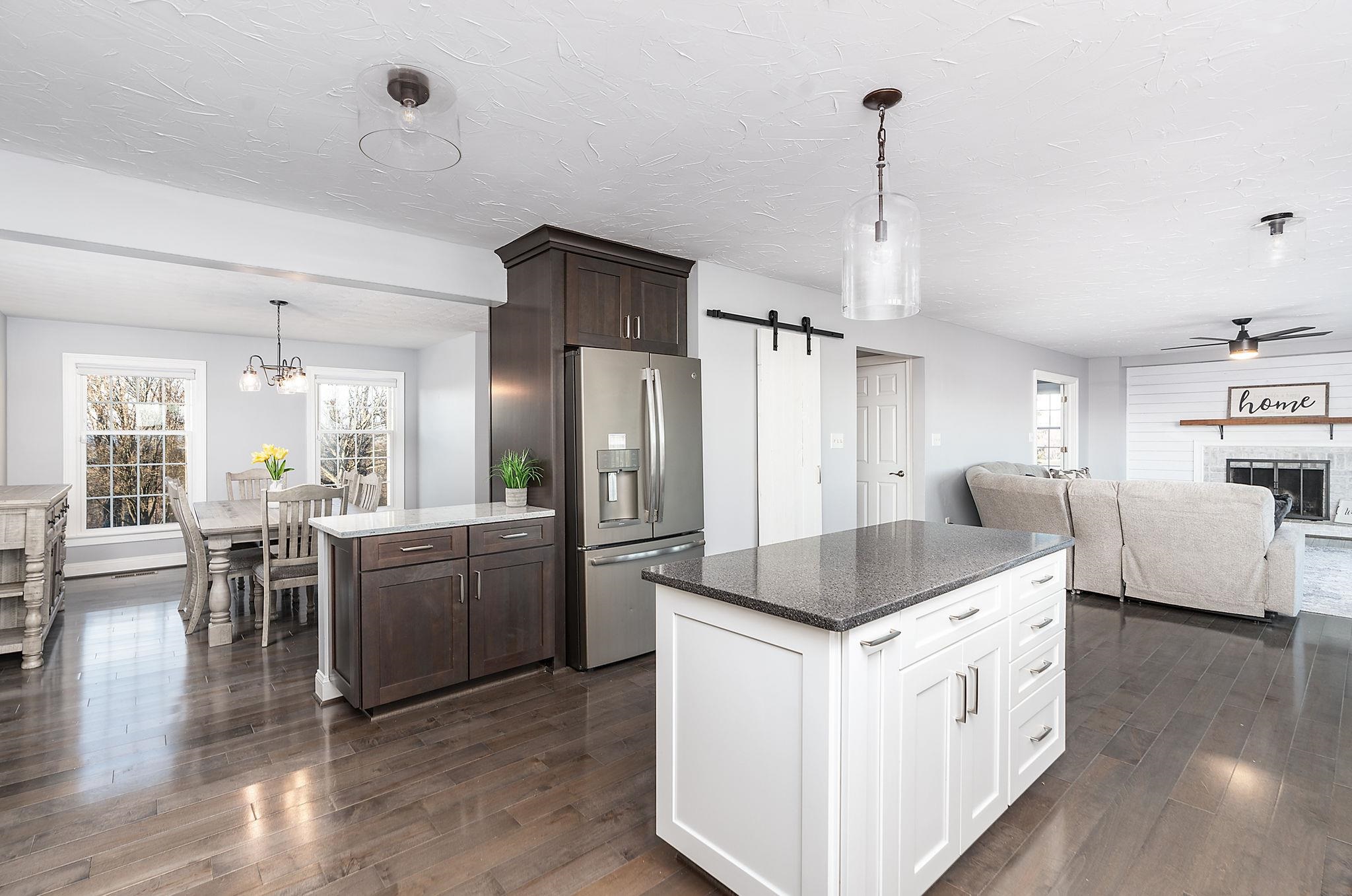 441 Barrenridge Road Fishersville, VA 22939 - Photo 20 of 71 a kitchen with stainless steel appliances kitchen island granite countertop a table chairs stove and refrigerator