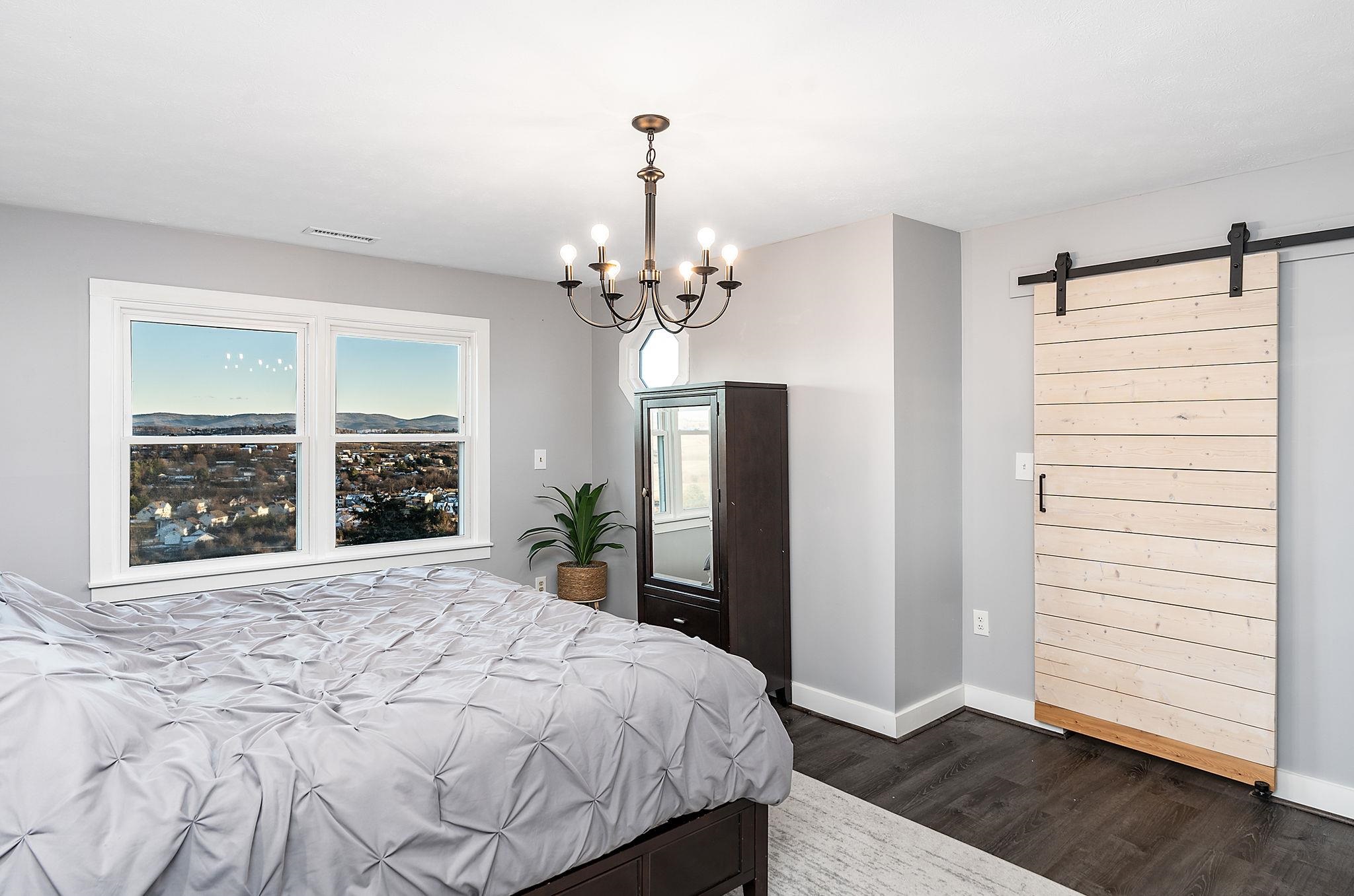 441 Barrenridge Road Fishersville, VA 22939 - Photo 33 of 71 a spacious bedroom with a large bed and a window