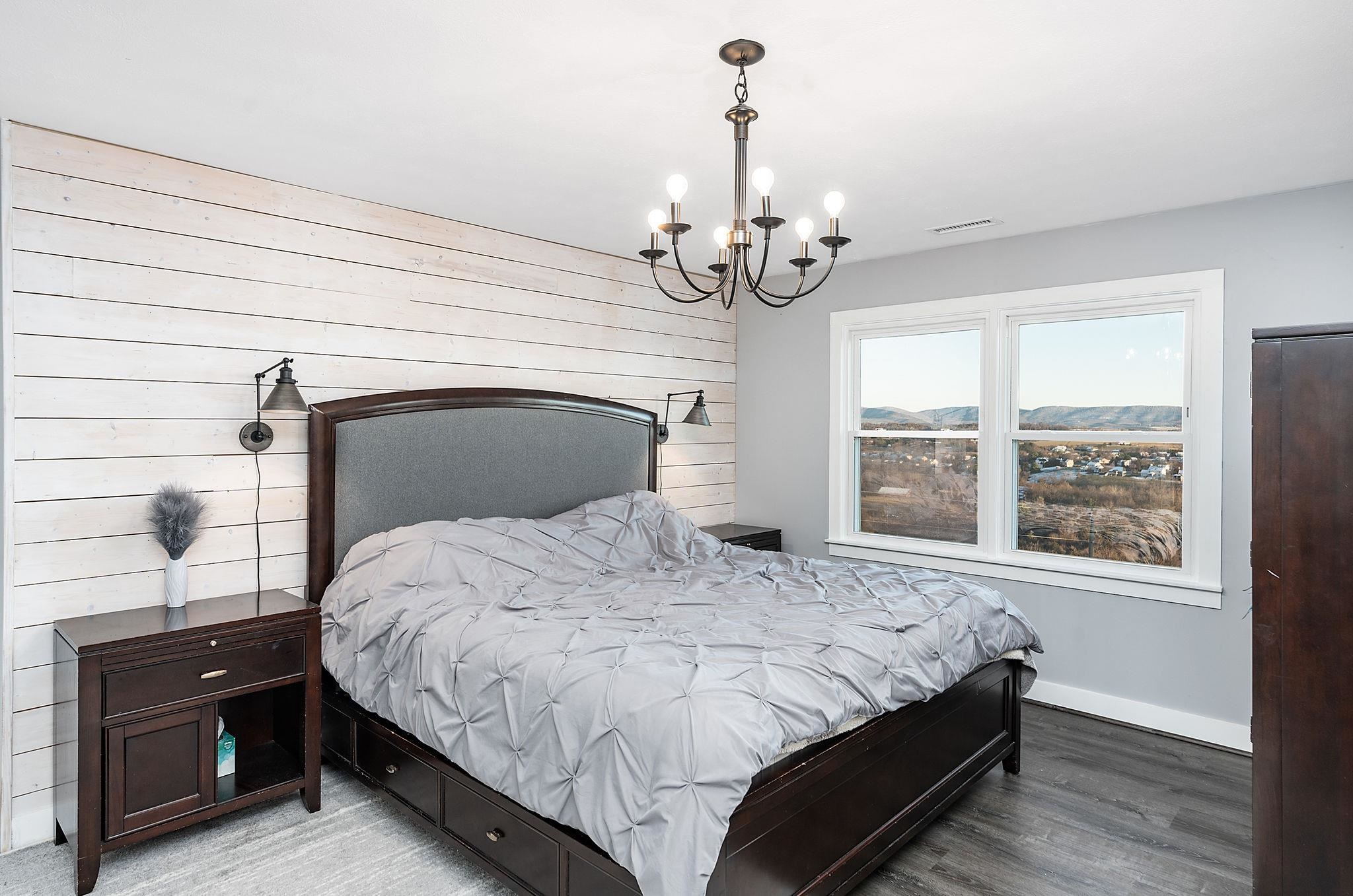 441 Barrenridge Road Fishersville, VA 22939 - Photo 34 of 71 a bedroom with a bed and wooden floor