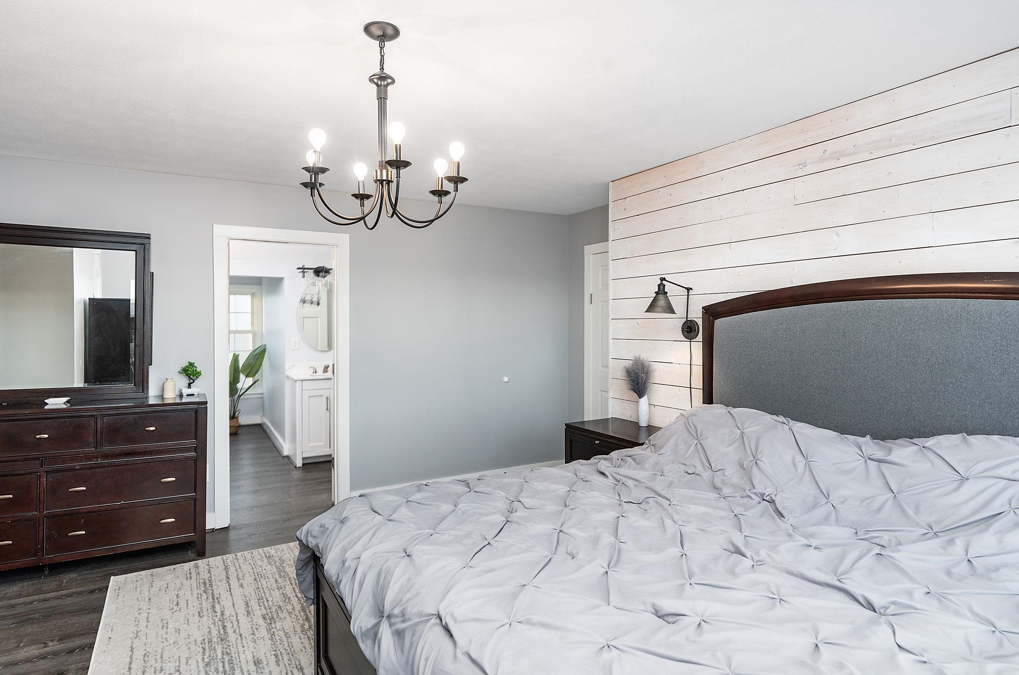 441 Barrenridge Road Fishersville, VA 22939 - Photo 35 of 71 a bedroom with a bed and a chandelier