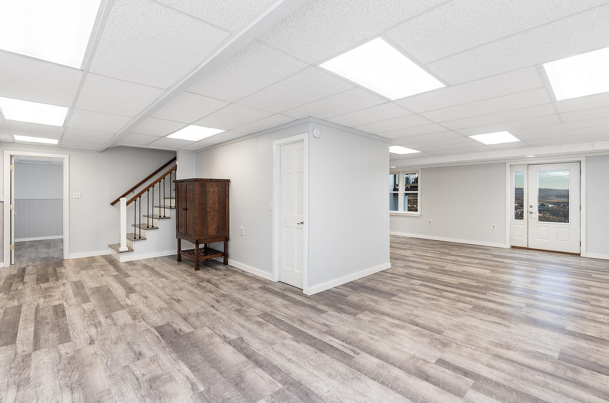 441 Barrenridge Road Fishersville, VA 22939 - Photo 43 of 71 a view of an empty room with wooden floor and a window