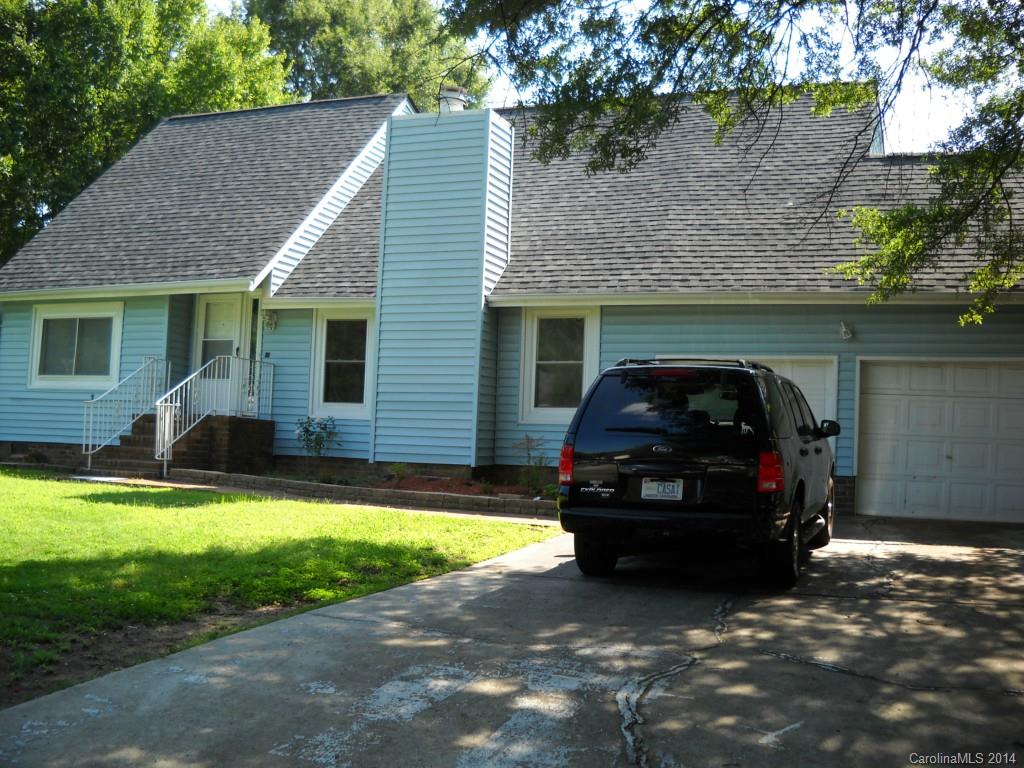 a car parked in front of a house