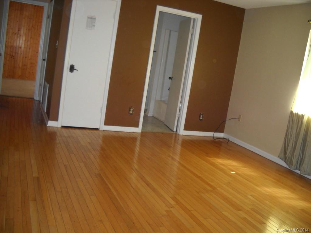 11405 Park Road Charlotte, NC 28226 - Photo 13 of 19 a view of a room with wooden floor