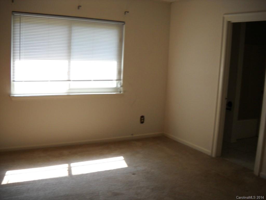 11405 Park Road Charlotte, NC 28226 - Photo 16 of 19 an empty room with a window