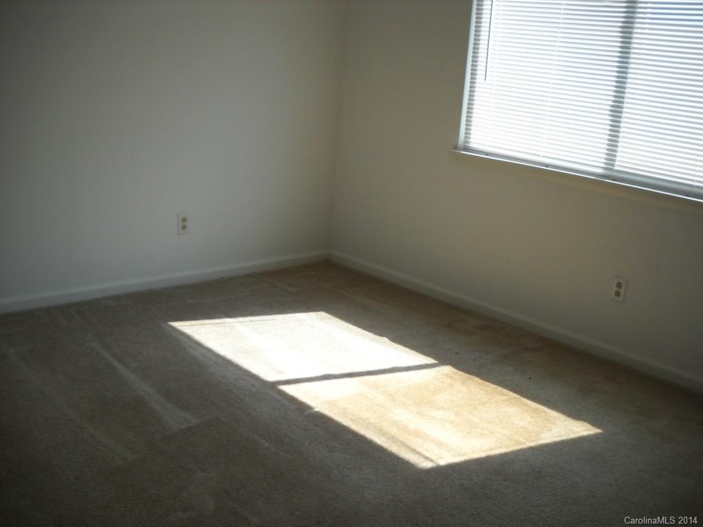 11405 Park Road Charlotte, NC 28226 - Photo 17 of 19 an empty room with a window