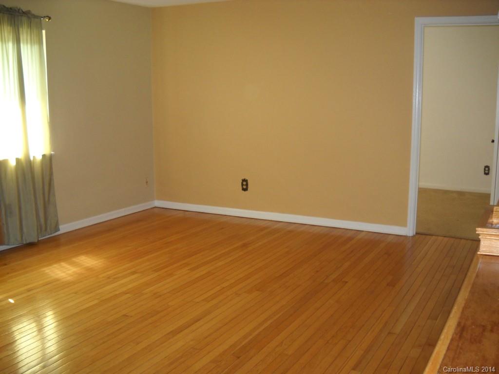 11405 Park Road Charlotte, NC 28226 - Photo 19 of 19 a view of empty room with wooden floor