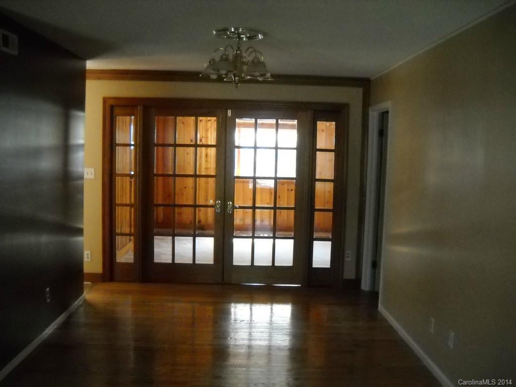 11405 Park Road Charlotte, NC 28226 - Photo 6 of 19 a view of a room with wooden floor and windows