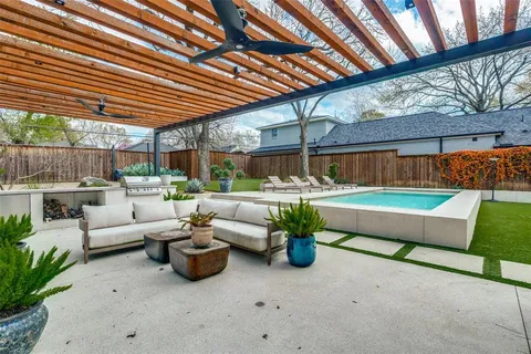 a outdoor living space with patio furniture and potted plants