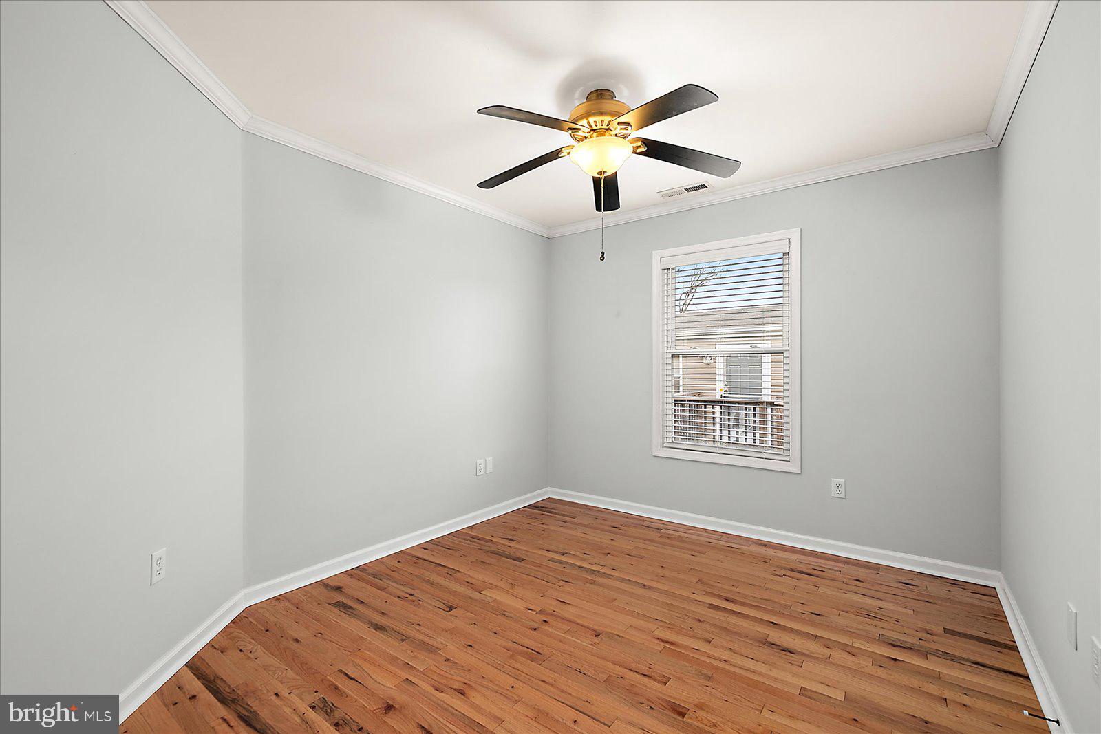 36405 Poplar Neck Road Willards, MD 21874 - Photo 33 of 50 a view of an empty room with wooden floor and a window