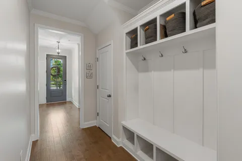 a view of an entryway with wooden floor