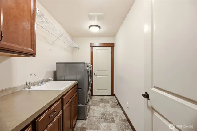 a bathroom with a sink a vanity and a mirror