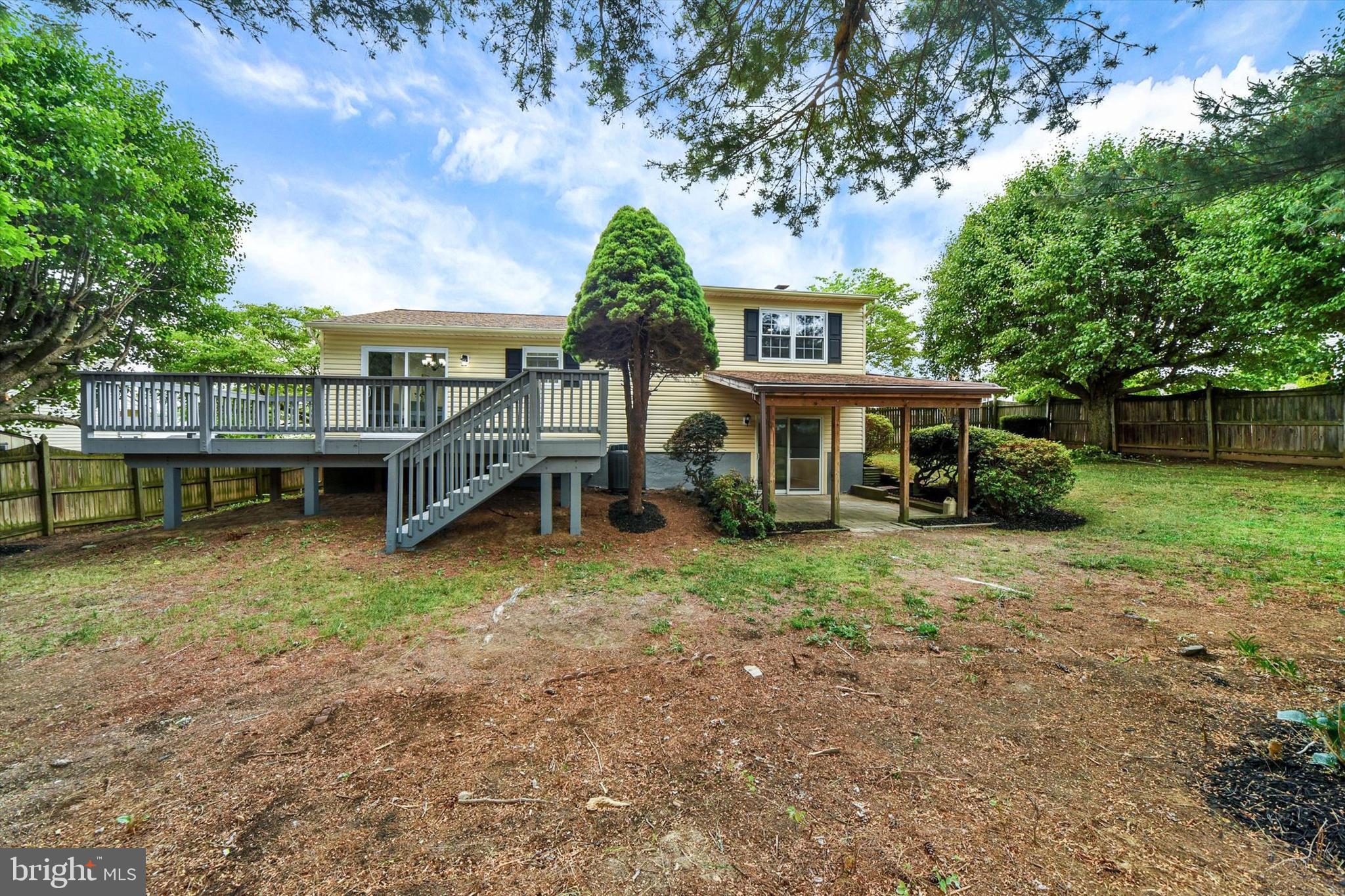 3808 Perryhurst Place Baltimore, MD 21236 - Photo 28 of 29 a front view of a house with a yard and potted plants