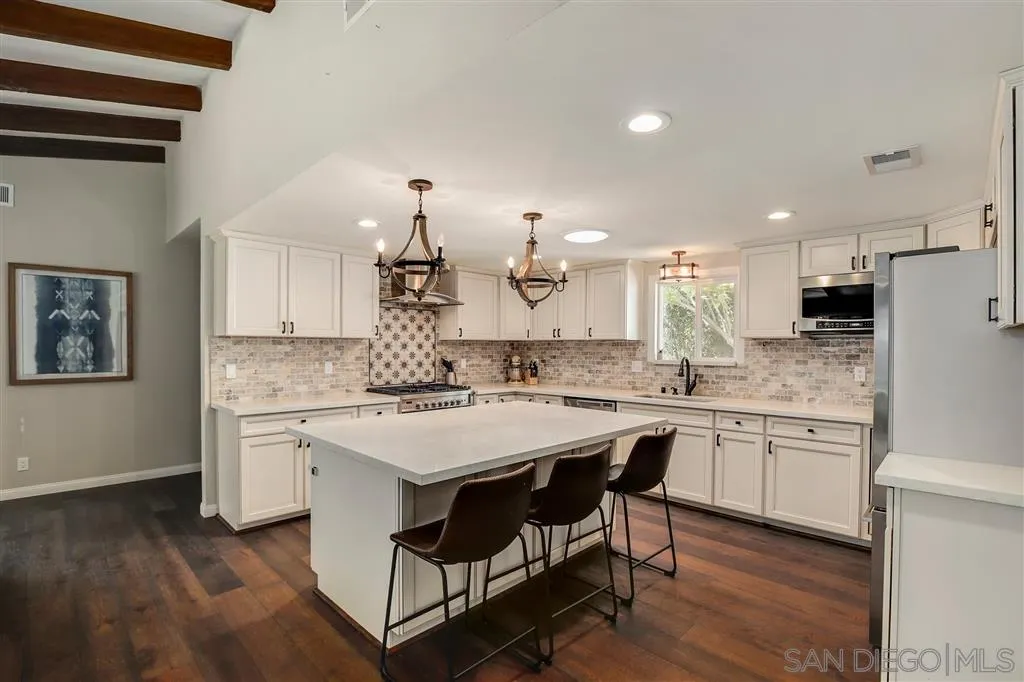 1285 Palomino Road Fallbrook, CA 92028 - Photo 11 of 25 a kitchen with a stove a sink and a refrigerator