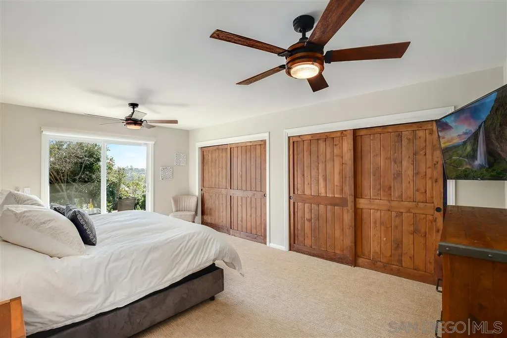 1285 Palomino Road Fallbrook, CA 92028 - Photo 12 of 25 a bedroom with a bed and a large window