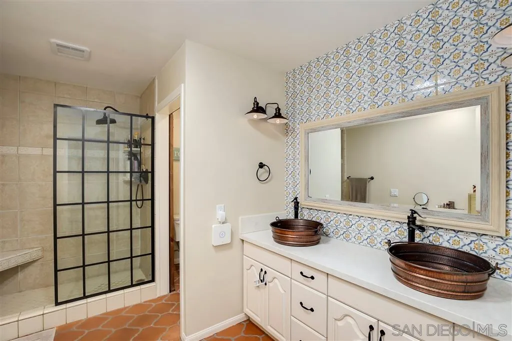 1285 Palomino Road Fallbrook, CA 92028 - Photo 15 of 25 a bathroom with a double vanity sink and