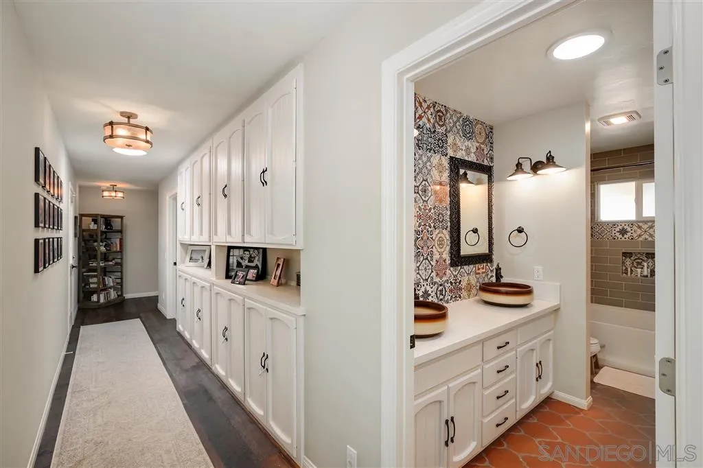 1285 Palomino Road Fallbrook, CA 92028 - Photo 16 of 25 a bathroom with double vanity sink and mirrors