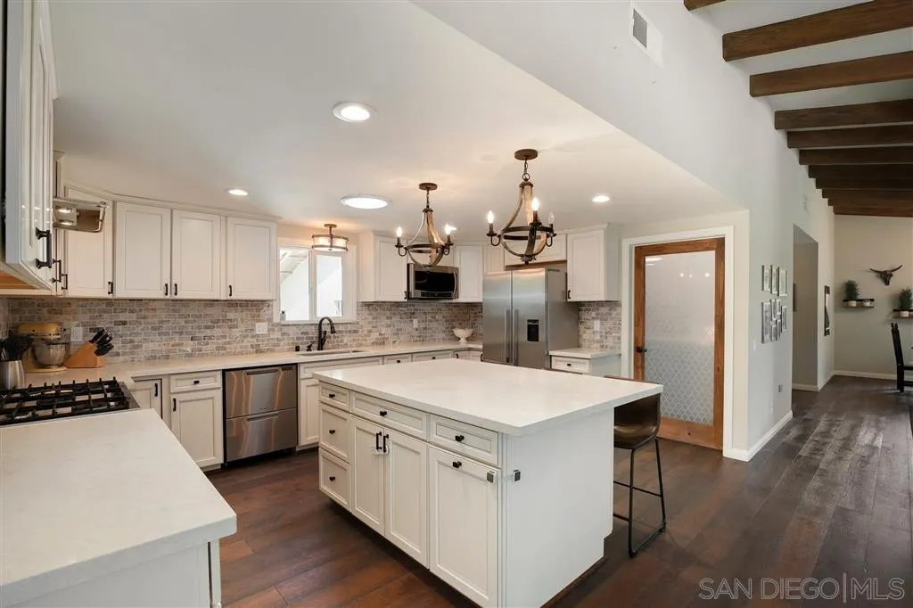 1285 Palomino Road Fallbrook, CA 92028 - Photo 10 of 25 a large white kitchen with a stove and refrigerator