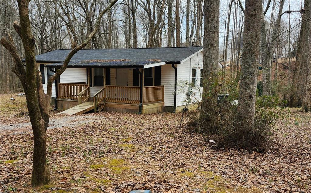 62 McClure Road Temple, GA 30179 - Photo 3 of 12 a view of a house with a yard and wooden fence