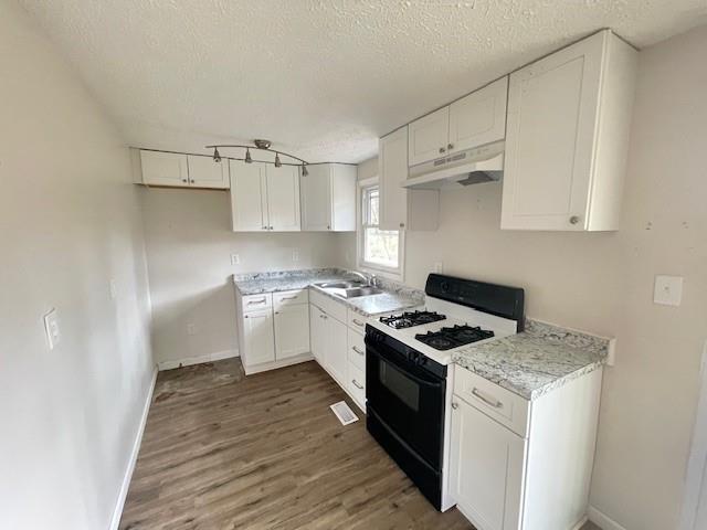62 McClure Road Temple, GA 30179 - Photo 4 of 12 a kitchen with cabinets appliances and a window