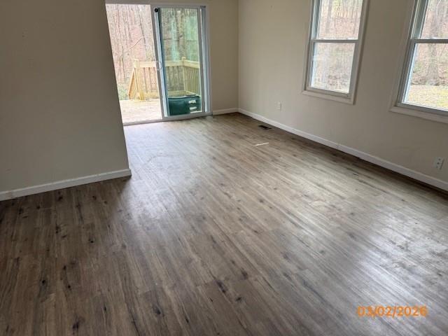 62 McClure Road Temple, GA 30179 - Photo 6 of 12 an empty room with wooden floor and windows