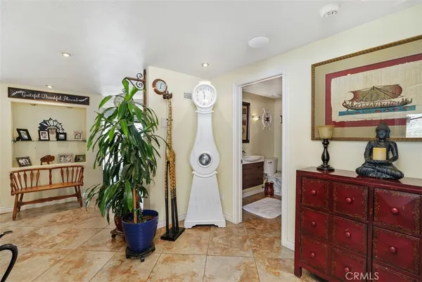 a kitchen with sink a stove and cabinets