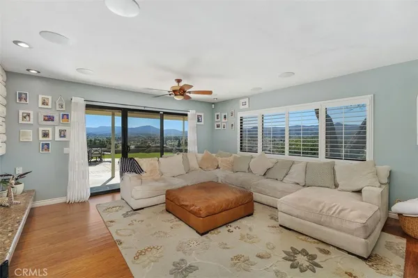 a dining room with kitchen island stainless steel appliances furniture a dining table and chairs