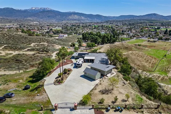 an aerial view of residential house with outdoor space