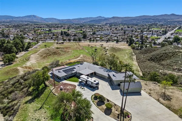 an aerial view of residential house with outdoor space
