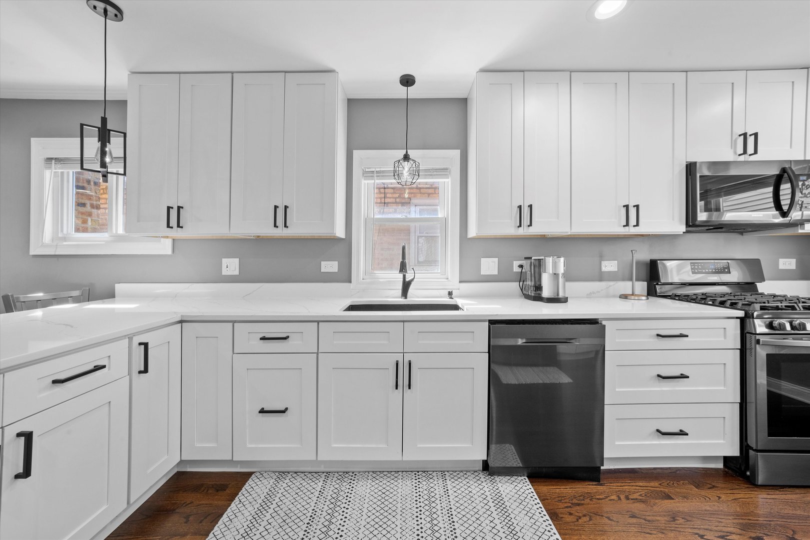 7114 West 64th Street Chicago, IL 60638 - Photo 12 of 43 a kitchen with cabinets appliances and a window