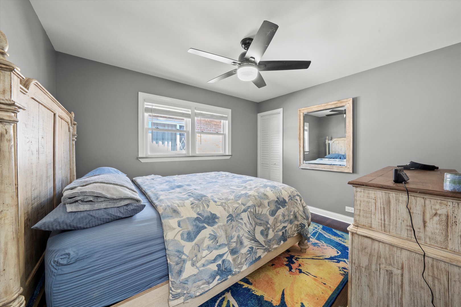 7114 West 64th Street Chicago, IL 60638 - Photo 16 of 43 a bedroom with a bed and a chandelier