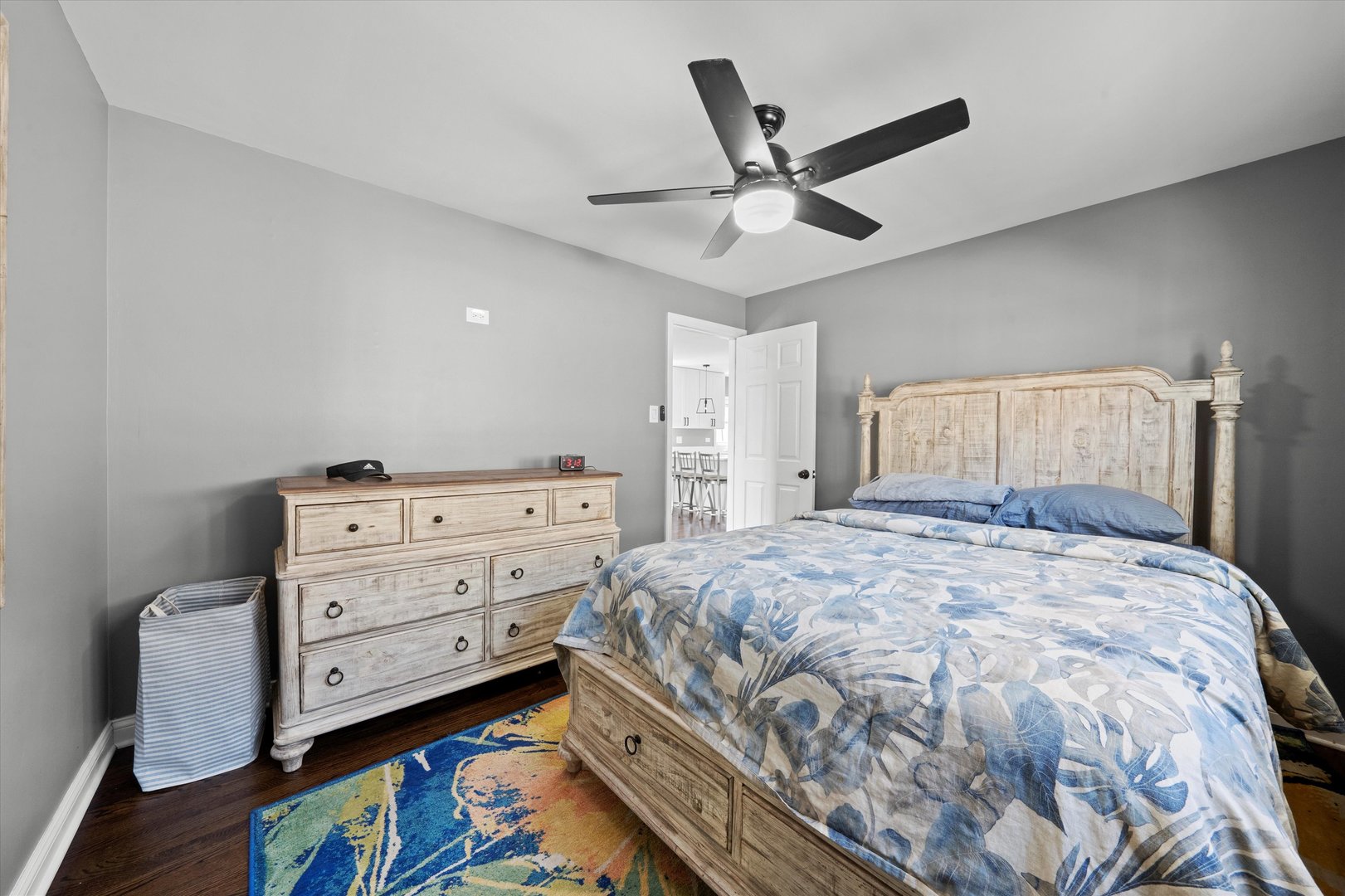 7114 West 64th Street Chicago, IL 60638 - Photo 17 of 43 a bedroom with a bed and a chandelier
