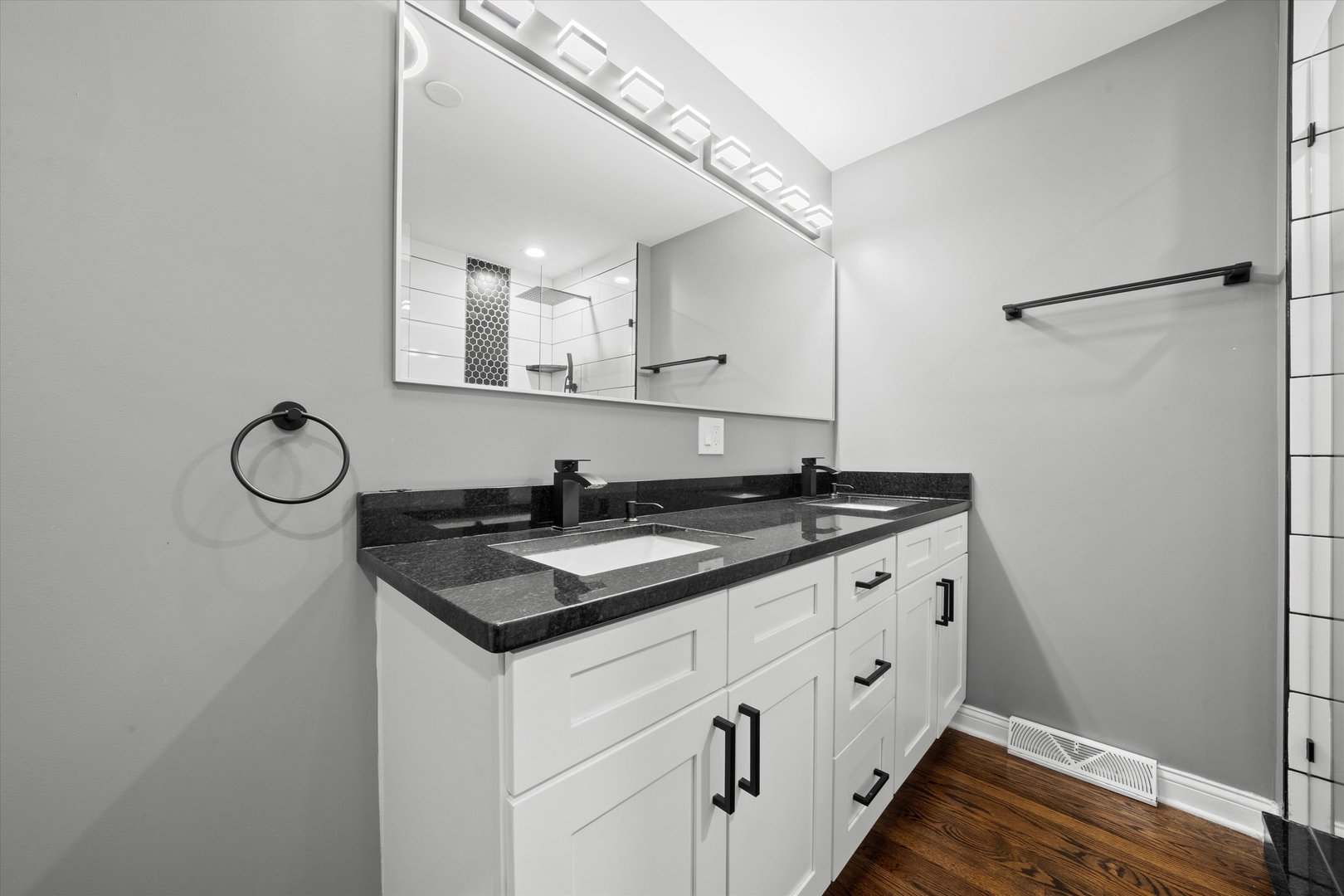 7114 West 64th Street Chicago, IL 60638 - Photo 20 of 43 a kitchen with granite countertop a sink and a stove with wooden floor