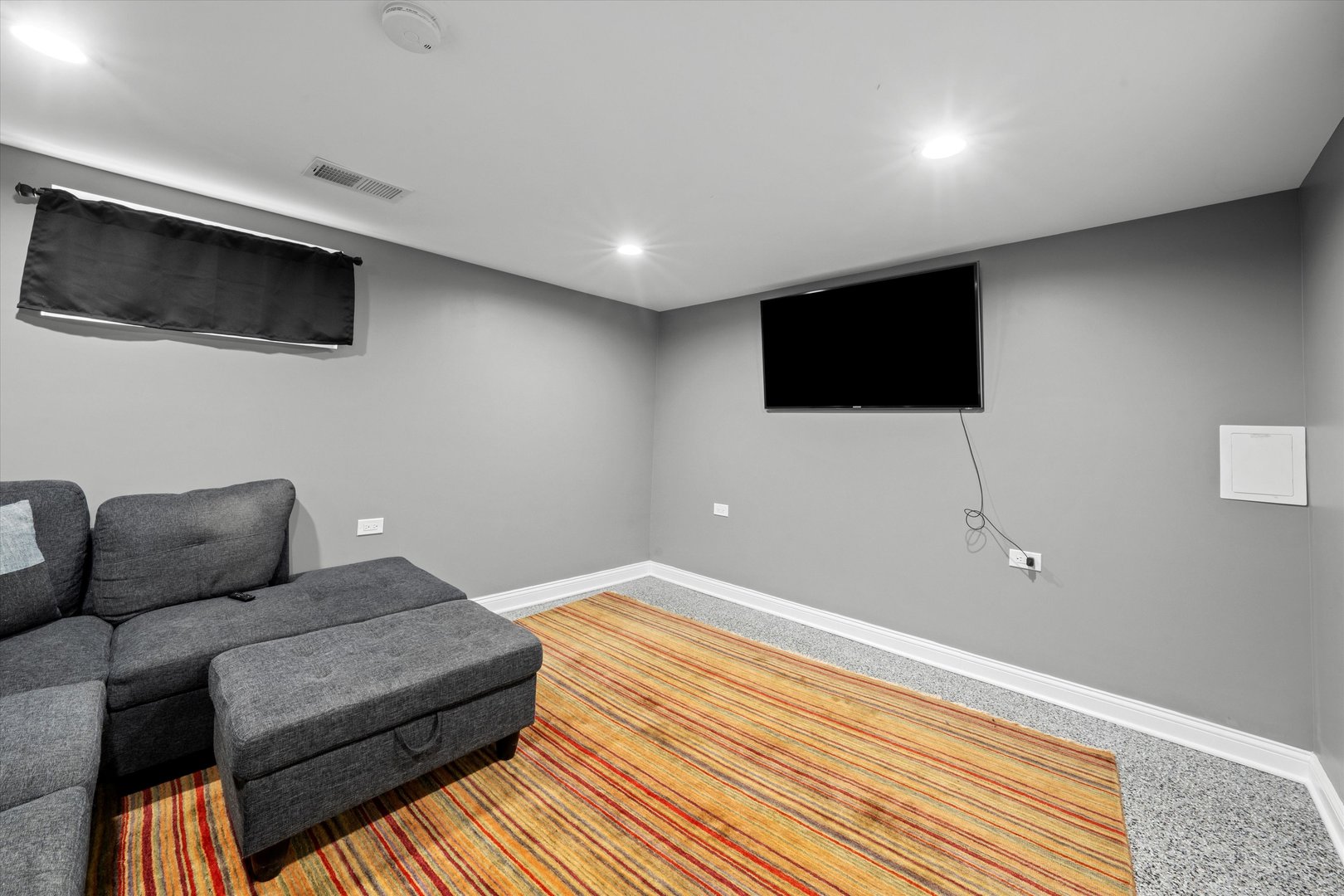 7114 West 64th Street Chicago, IL 60638 - Photo 25 of 43 a living room with furniture and a flat screen tv
