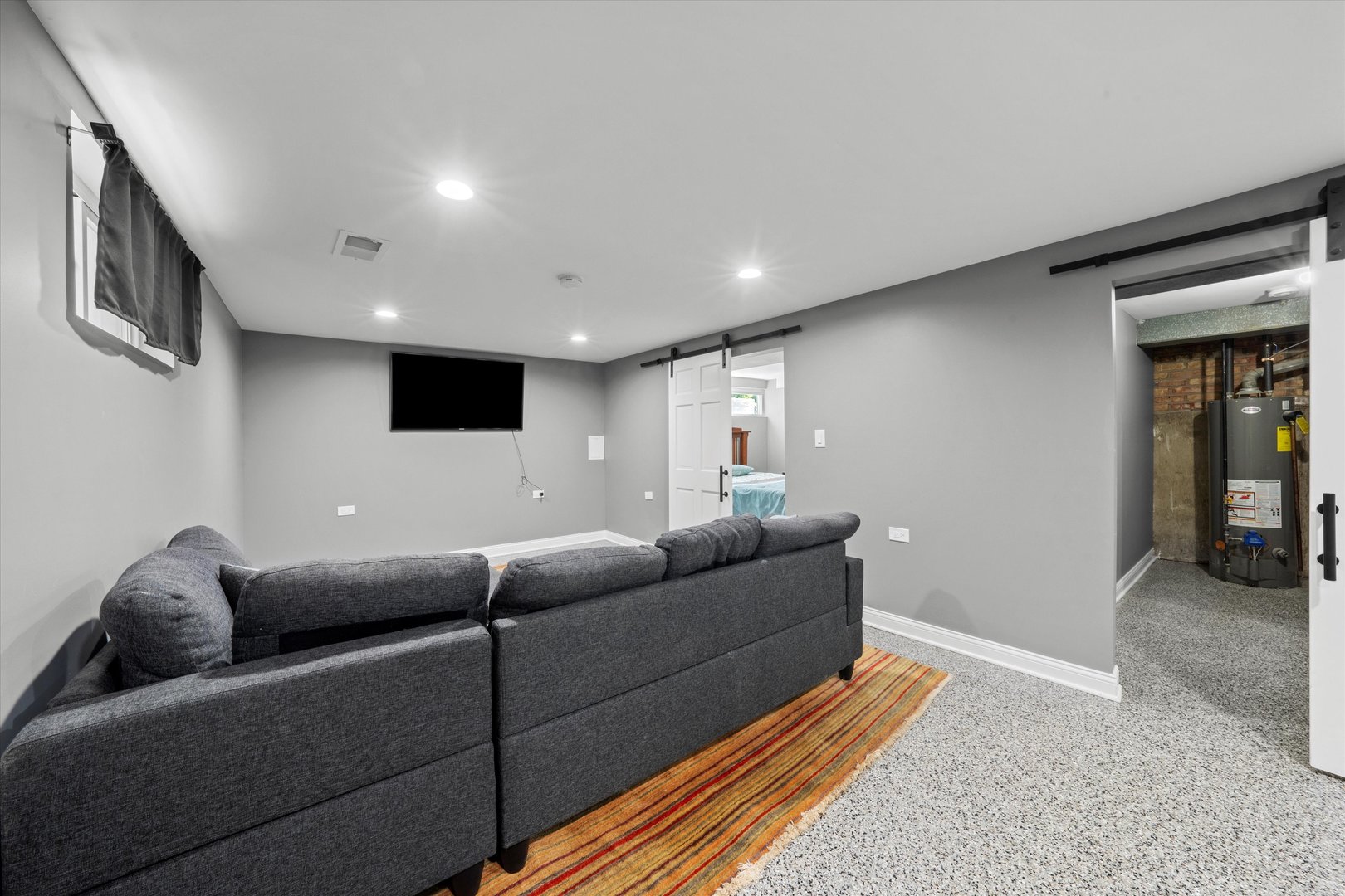 7114 West 64th Street Chicago, IL 60638 - Photo 28 of 43 a living room with furniture and a flat screen tv