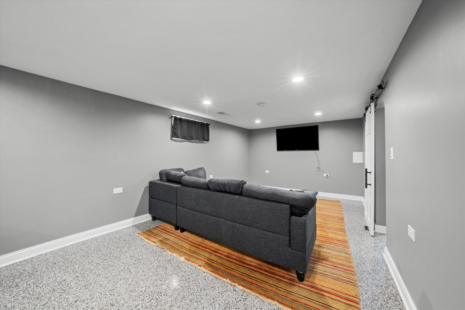 7114 West 64th Street Chicago, IL 60638 - Photo 29 of 43 a living room with furniture and a flat screen tv