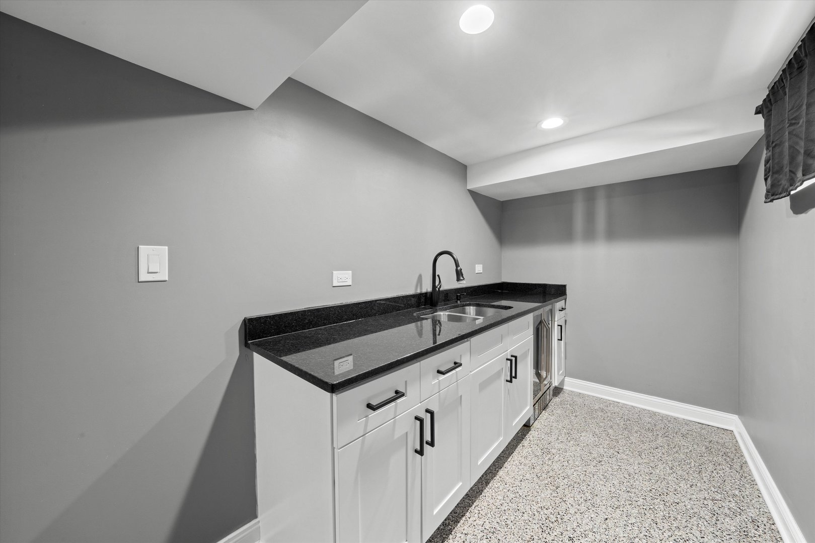 7114 West 64th Street Chicago, IL 60638 - Photo 30 of 43 a kitchen with granite countertop a sink and cabinets