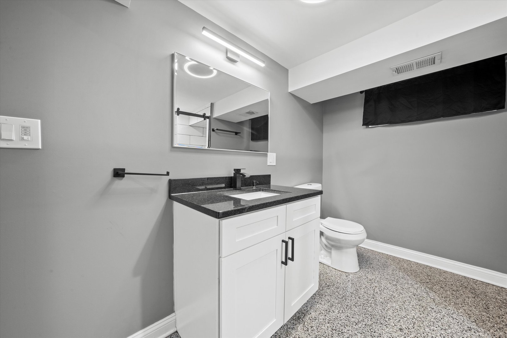 7114 West 64th Street Chicago, IL 60638 - Photo 33 of 43 a view of bathroom with a sink and a toilet