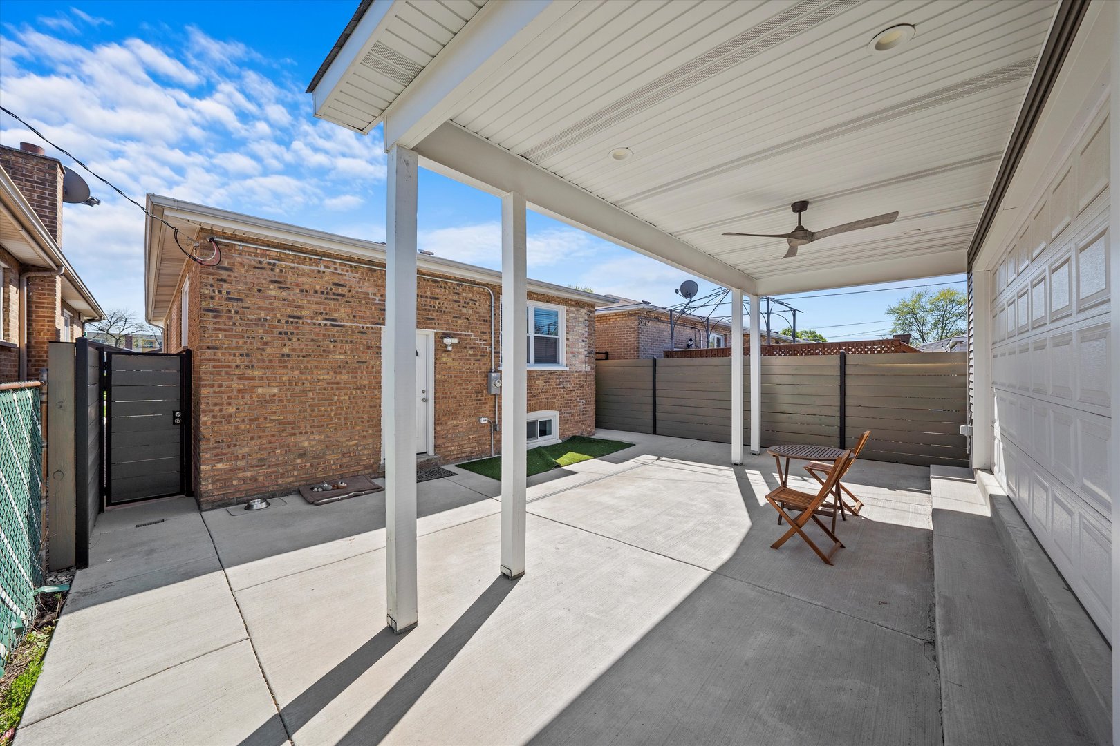 7114 West 64th Street Chicago, IL 60638 - Photo 39 of 43 a patio with table and chairs