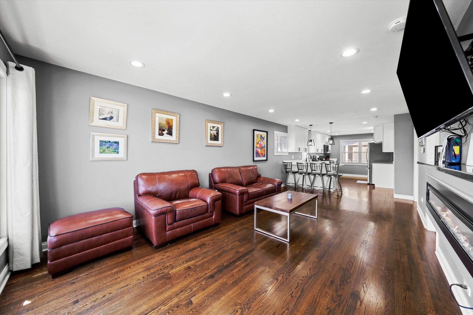 7114 West 64th Street Chicago, IL 60638 - Photo 4 of 43 a living room with furniture and a flat screen tv